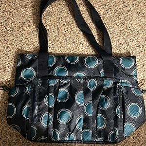 Thirty One brand new bag. Navy with green circle design, nylon material.